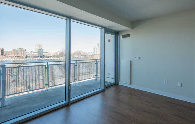 Vesta Living Room with Floor-to-Ceiling Windows and Balcony