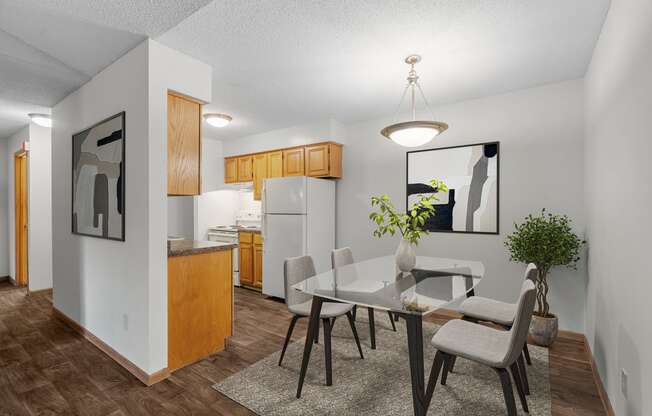 our apartments offer a dining room table and chairs and a kitchen