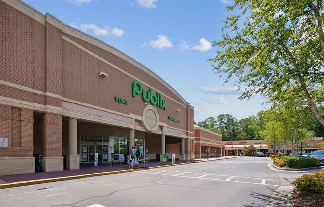 A large building with a green sign that says