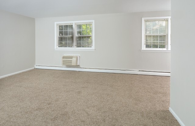 Phenomenal furnished open-concept living room with carpeting in Hatboro, PA apartments
