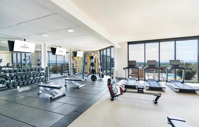 Expansive fitness center with strength training, cardio, and stunning mountain views to match your motivation.