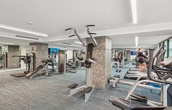 Fitness center with a variety of strength and cardio equipment at Twenty2 West luxury apartments in Miami, FL