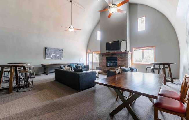 A living room with a fireplace and a television.