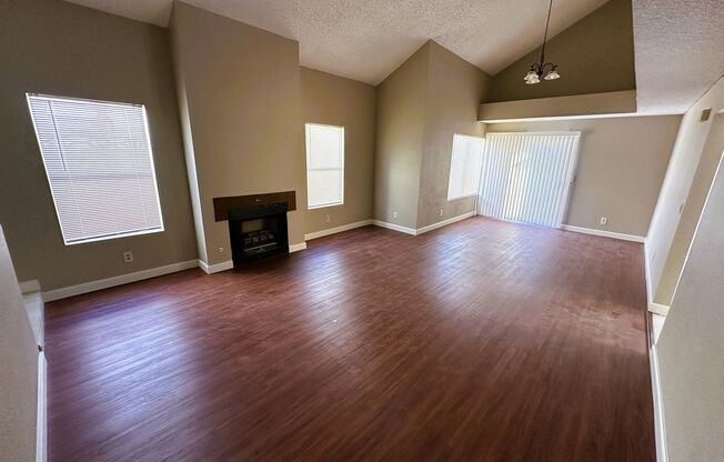 Newly renovated home with brand new kitchen and flooring downstairs! Home features a large living room with a fireplace and a separate family room! Brand new large kitchen cabinets and countertops! A large backyard! And is nearby the Summerlin Parkway hig