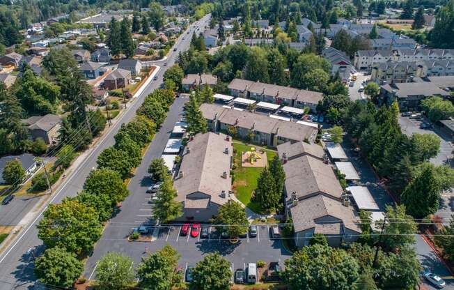 an aerial view of a neighborhood with houses and trees at Quartz Creek, Washington, 98043