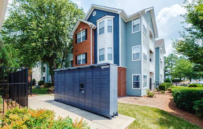 a blue and brick apartment building with a blue garage door