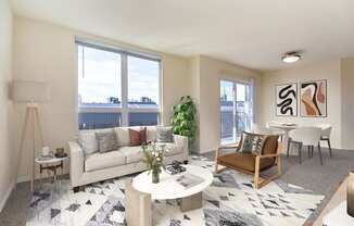 A living room with a couch, a chair, a table, and a potted plant.