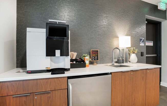 a kitchen with a coffee maker and a sink