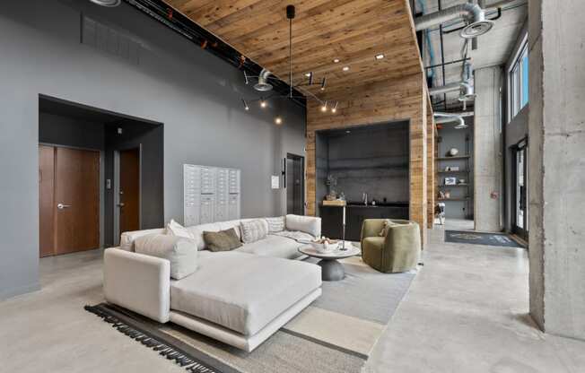 a living room with a large white couch and a table