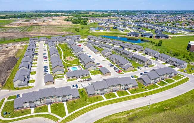 Well-maintained landscaping with manicured shrubs and paved walkways.