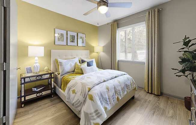 Bedroom with ceiling fan, large window, and plank-style flooring at The Madison Franklin, Tennessee, 37064