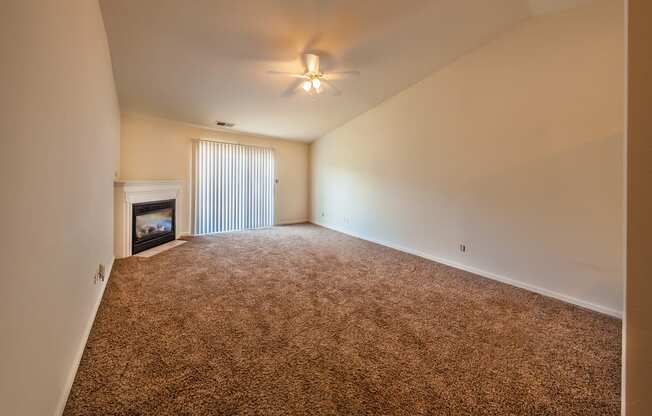 Spacious living room with gas fireplace at Barton Farms in Greenwood, IN 46143