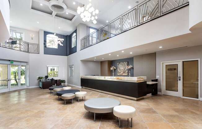 A spacious lobby with a reception desk and seating area. at La Jolla Crossroads Apartments, California