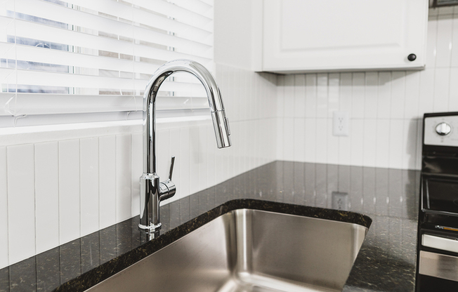 Chrome kitchen faucet with pull down spray head