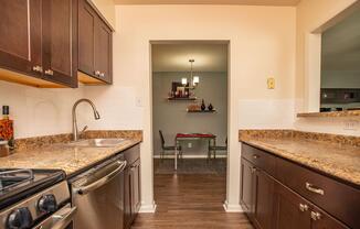 a kitchen with a stove and a sink