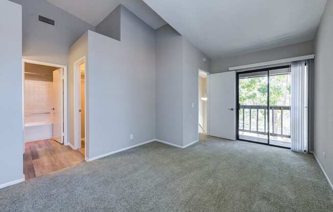 Bedroom with sliding glass doors to balcony