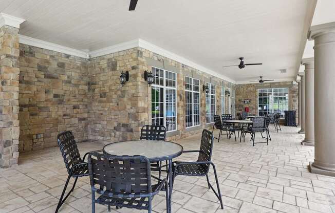 A patio with a table and chairs.