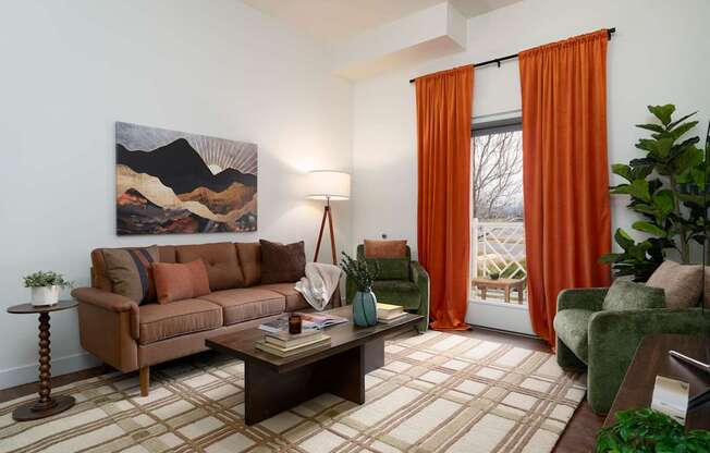 A living room with a brown couch, a coffee table, and a painting on the wall.