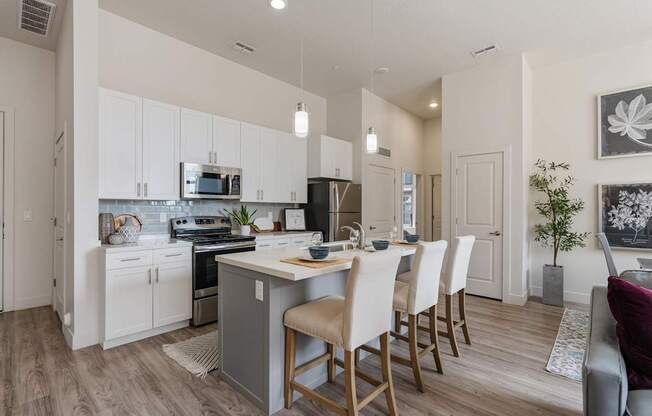an open kitchen and dining area with a table and chairs