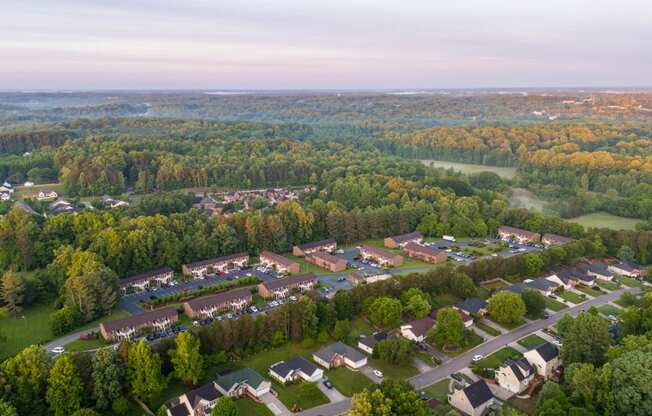 an aerial view of a neighborhood with houses and trees