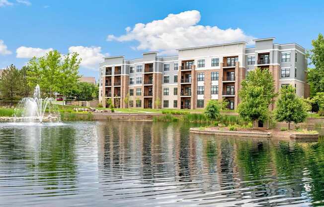 A large building with a fountain in front of it.