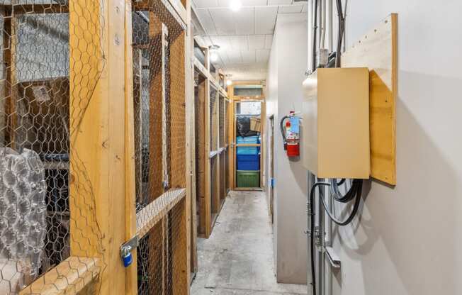 a long hallway with wood framing and a fire hydrant
