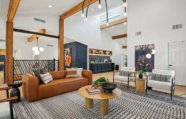 A living room with a brown sofa and a coffee table.