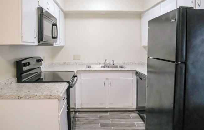 Image of a fully-equipped kitchen with energy-efficient appliances at Chouteau Heights