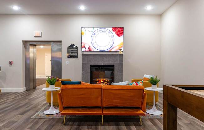 a living room with a couch and a fireplace
