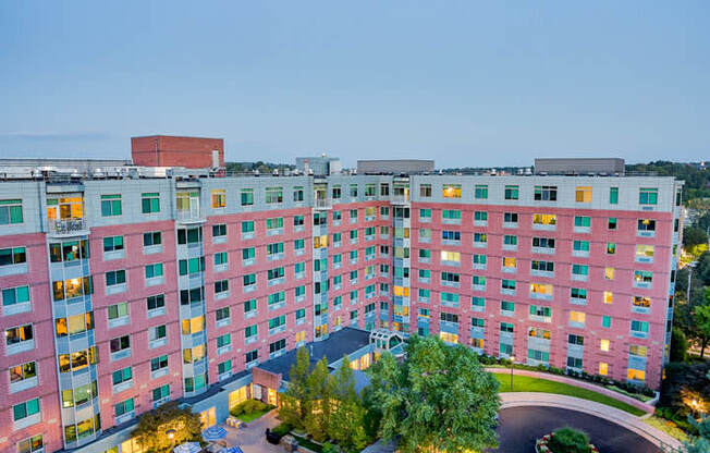 an aerial view of a hotel with a swimming pool