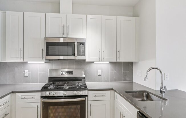 Kitchen with granite countertop and sink at Park77 Apartments, Cambridge, MA