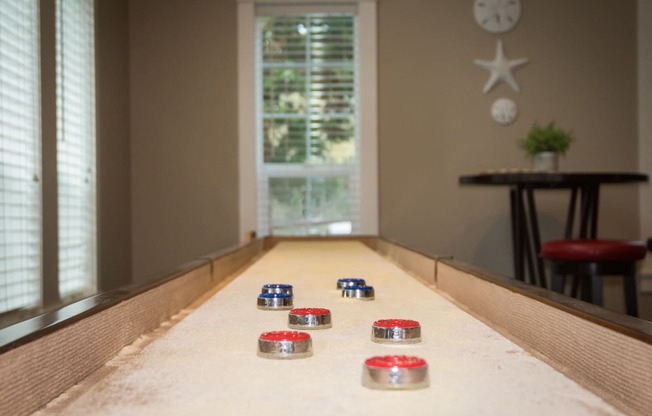 Stillwater clubhouse interior shuffleboard amenity