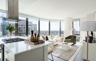 A modern kitchen with a view of the city.