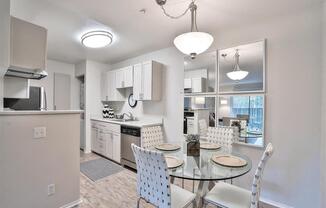 Hayward, CA Apartments - Renovated Kitchen Has Wood-Inspired Flooring, White Cabinets, Stainless Steel Appliances, Dishwasher, And A Washer And Dryer Unit