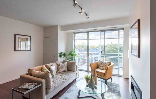 Living room of 1800 Lake with balcony and a fireplace