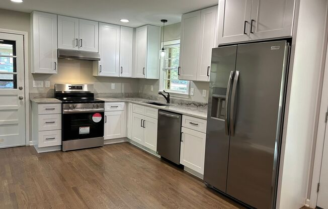 JUST LIKE NEW! Landlord just finishing up doing a total remodel on this 3 bedroom/2 bath home with large outbuilding.