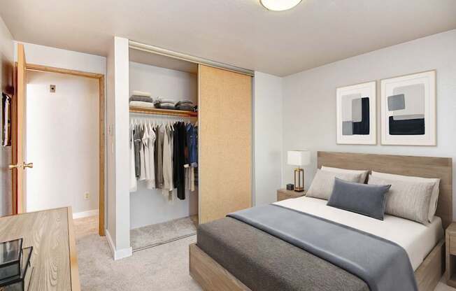 A bedroom with a large bed and a wardrobe.