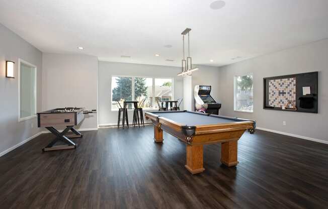 Hinton Height_Cottage Grove_MN_an open living room with a pool table and a piano