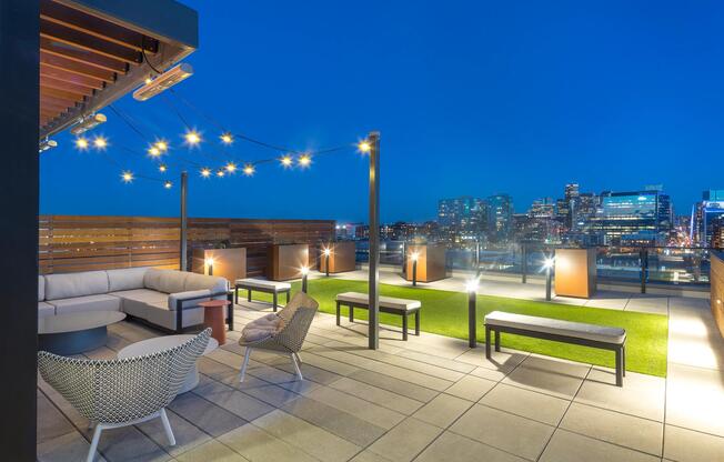 Rooftop deck with lush landscaping, fire pits, outdoor tv, plus city and mountain views.