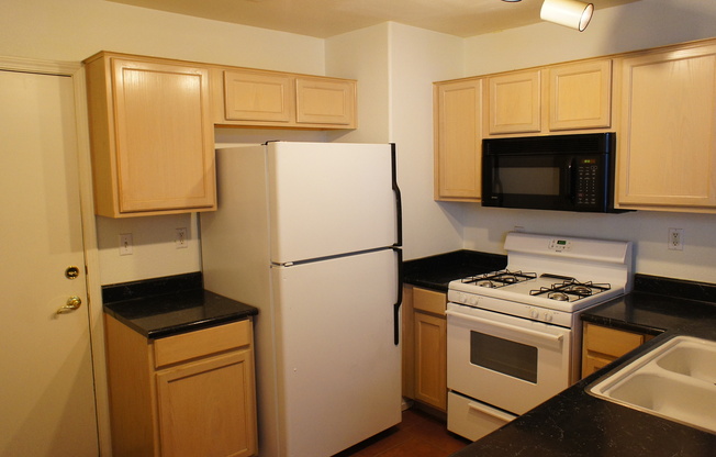 THIS IS A CHARMING TWO-STORY NORTH LAS VEGAS HOME WITH 2 BEDROOMS, 2.5 BATHS AND A TWO-CAR ATTACHED GARAGE. FEATURING TILE AND CARPET FLOORING, NEUTRAL PAINT, AND BLINDS THROUGHOUT, THE MAIN LEVEL OFFERS AN OPEN LIVING AND DINING AREA THAT FLOWS INTO A KI