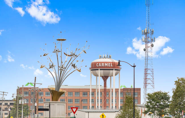 a water tower on top of a building in front of a hospital