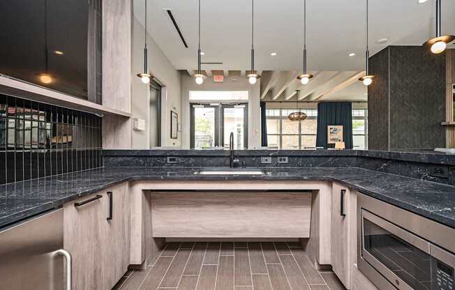 A modern kitchen with a large island in the center.