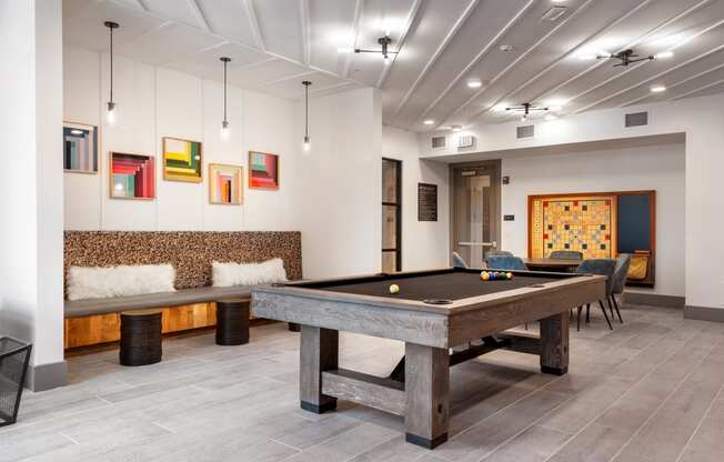 game room with a pool table at the cannery at the packing district apartments
