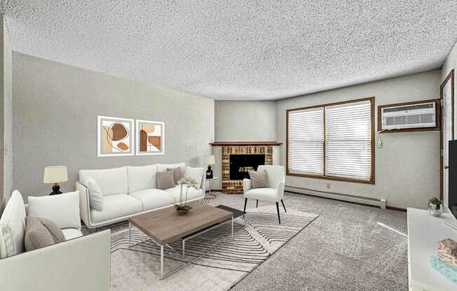 a living room with white furniture and a fireplace at Creekstone Falls, Sioux Falls, SD