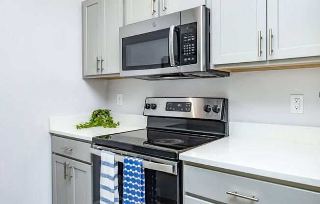 a stove top oven sitting inside of a kitchen