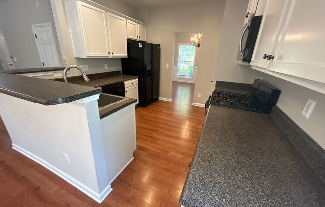 4 Bedroom | 3 Bathroom Apex Home with Fenced Backyard