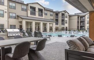 Resort-Style Pool with Grilling Area, Tanning Ledges, Cabanas & Hot Tub at The Bridge at McKinney