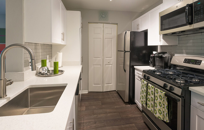 Redesigned kitchens with granite counters, stainless steel appliances and subway tile