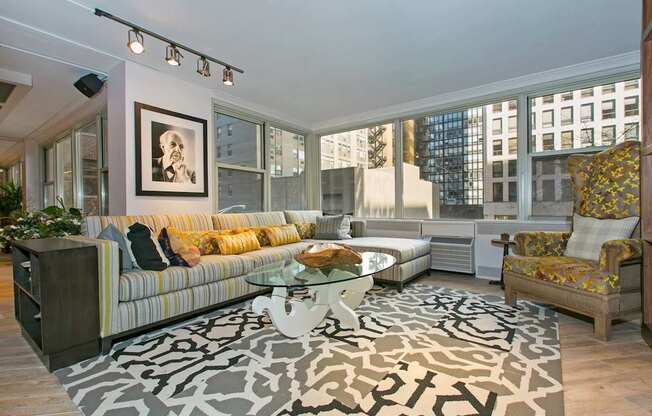 a living room with a couch and a glass coffee table