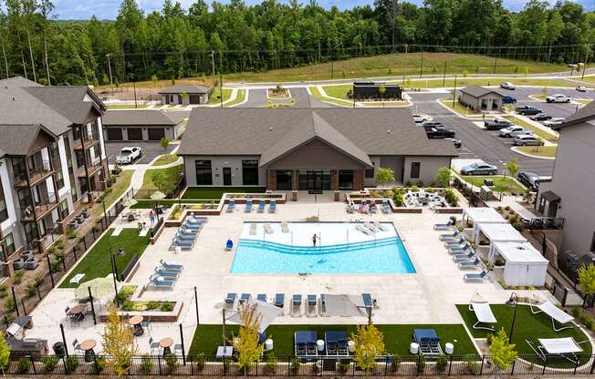 an aerial view of the pool at the resort on a sunny day